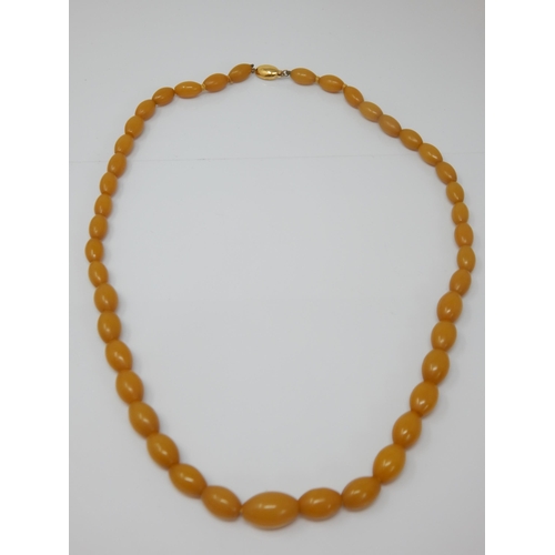 97 - 9ct Gold Clasped Amber Bead Necklace: Length 64cm: Weight 38g