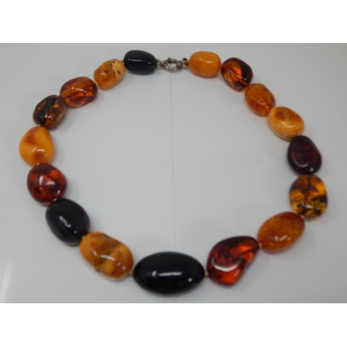304 - Silver Mounted Large Amber Necklace: Weight 144g