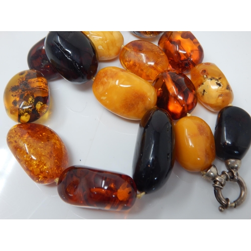 304 - Silver Mounted Large Amber Necklace: Weight 144g