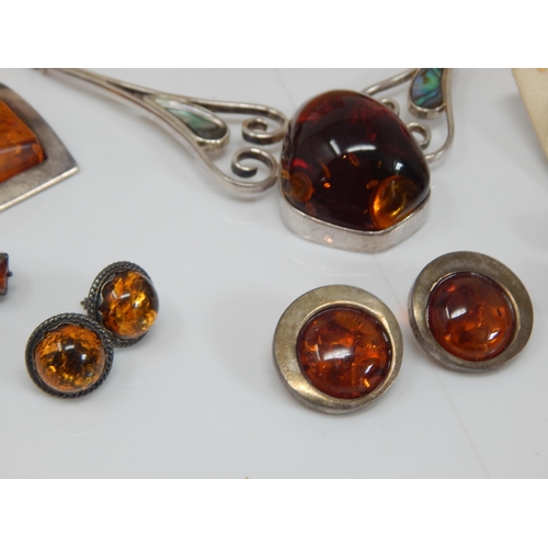 309 - Quantity of Silver Mounted Amber Jewellery: Gross weight 200g