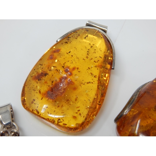 310 - 4 x Large Amber Pendants: Gross weight 126g
