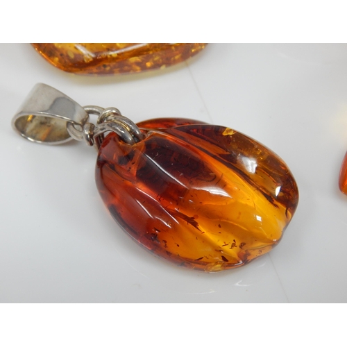 310 - 4 x Large Amber Pendants: Gross weight 126g