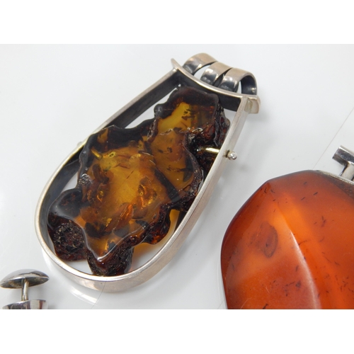 312 - 4 x Large Amber Pendants: Gross weight 128g