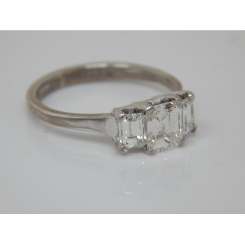 75 - 18ct White Gold 3 Stone Diamond Ring. The Central Princess Cut Diamond Estimated @ 1.0ct, Bordered b... 