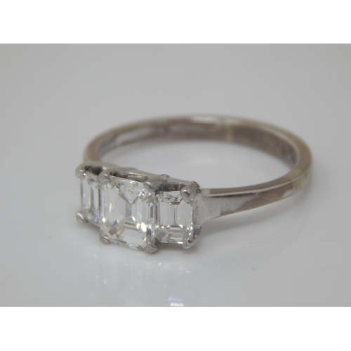 75 - 18ct White Gold 3 Stone Diamond Ring. The Central Princess Cut Diamond Estimated @ 1.0ct, Bordered b... 