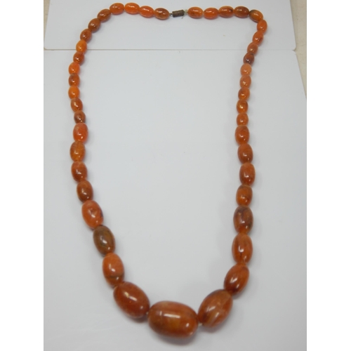 332 - Vintage Graduated Amber? Bead Necklace with screw clasp: Length 74cm: Weight 60g