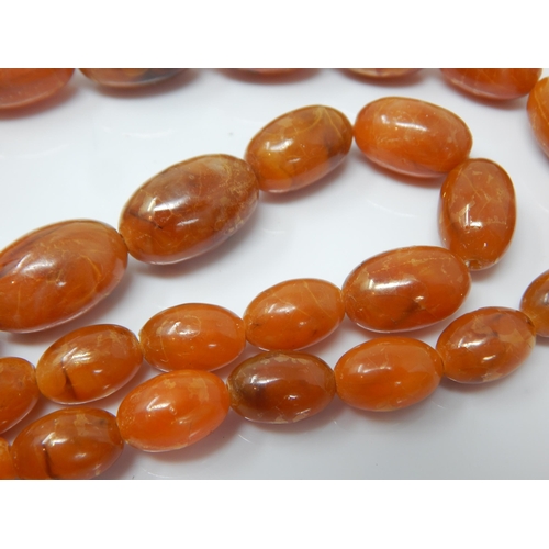 332 - Vintage Graduated Amber? Bead Necklace with screw clasp: Length 74cm: Weight 60g
