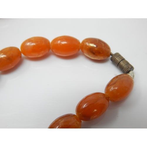332 - Vintage Graduated Amber? Bead Necklace with screw clasp: Length 74cm: Weight 60g