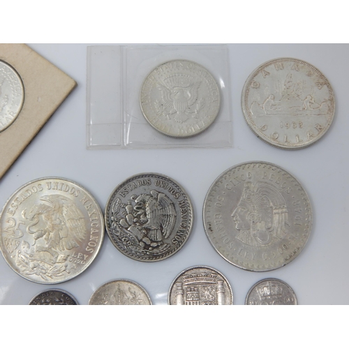 18 - A Quantity of Silver Coinage Including an 1875 Austrian 1 Fl, 1963 Canadian Silver Dollar, 1968 Silv... 