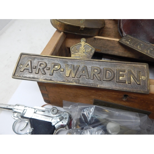 999A - A Wooden Box containing a Quantity of Militaria Including Brass A.R.P & Air Warden Plaques, Cap Gun,... 