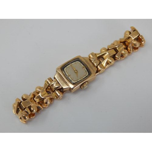 102 - 18ct Gold Ladies Wristwatch on 18ct Gold Strap: Gross weight 21.75g