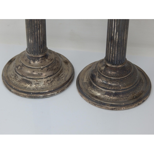 73 - A Pair of Silver Candlesticks: Hallmarked Birmingham 1913 by William Deakin: Height 17.5cm