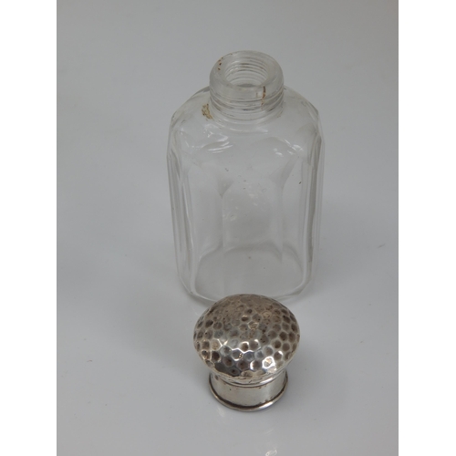 77 - A Victorian Silver Mounted Cut Glass Scent Bottle Hallmarked London 1855 together with another.