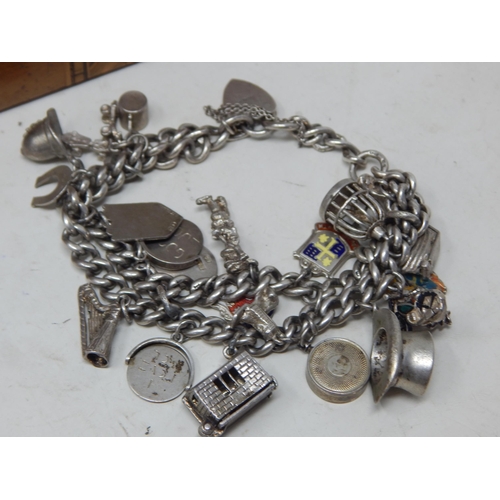 82 - A Quantity of Silver Including a Charles Horner Hatpin, Charm Bracelets, Bangle etc: Weight 174g: Al... 