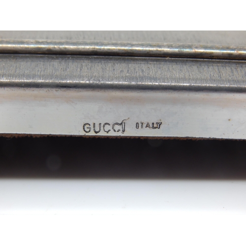 91 - GUCCI, Italy Easel Back Photograph Frame Measuring 20.8cm x 17cm together with a Hallmarked Silver P... 