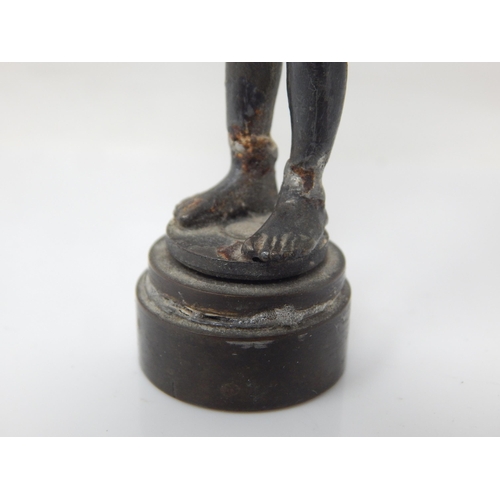 206 - A Bronze Desk Seal Formed as a Smoking Boy: Height 9.5cm: Repaired.