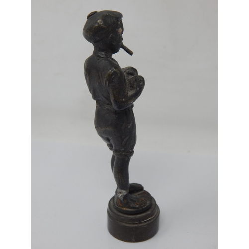 206 - A Bronze Desk Seal Formed as a Smoking Boy: Height 9.5cm: Repaired.