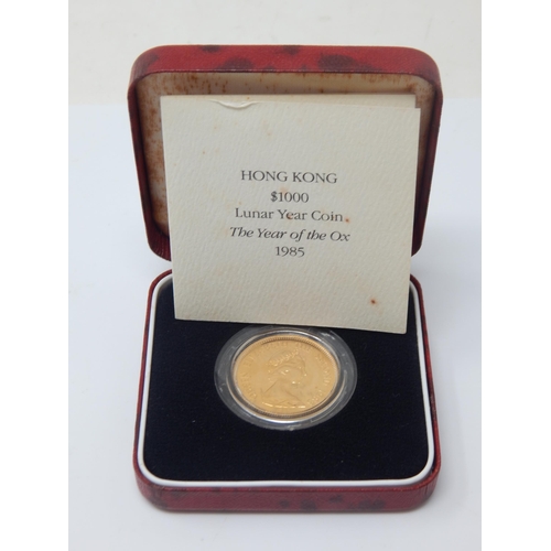 8 - Royal Mint 22ct Gold Hong Kong Lunar Year of The Ox Coin 1985 in case of issue with COA: Weight 15.9... 