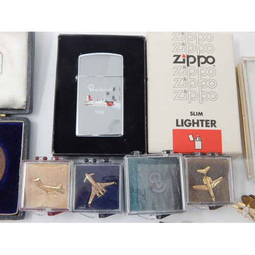 115 - A Quantity of Hallmarked Silver Fobs (56g) together with a Zippo Lighter in original box, aviation p... 