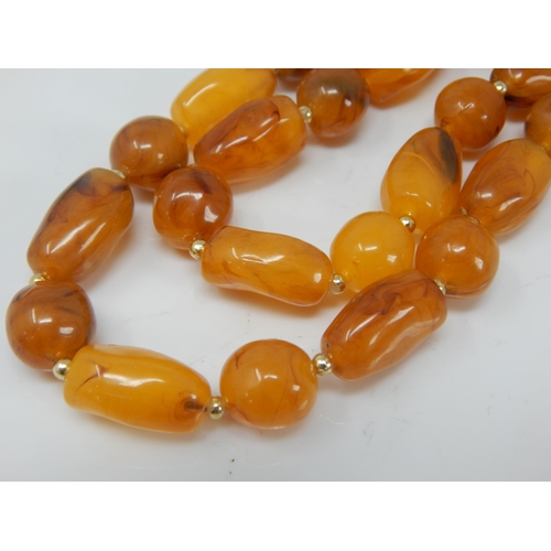 136 - Butterscotch Amber Necklace: Length 76cm: Weight 52g