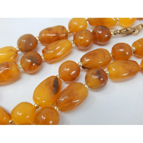 136 - Butterscotch Amber Necklace: Length 76cm: Weight 52g