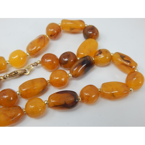 136 - Butterscotch Amber Necklace: Length 76cm: Weight 52g