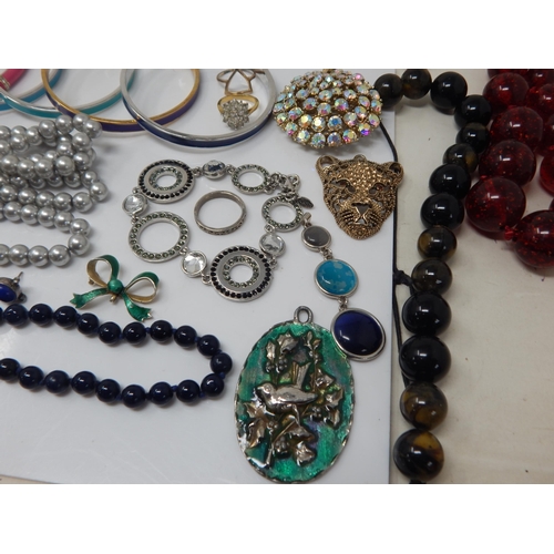 137 - A Large Quantity of Costume Jewellery Including a Lapis Lazuli Necklace, Silver Earrings, Calvin Kle... 