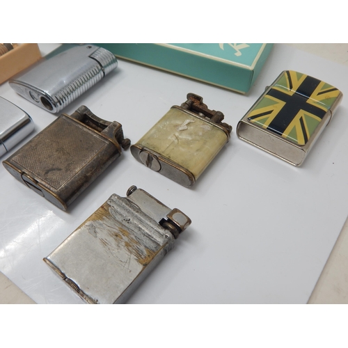 276 - A Collection of Vintage Lighters Including an early example by Dunhill