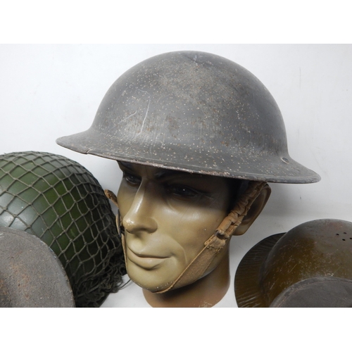 311 - A Quantity of Military Helmets