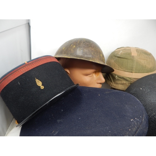 314 - A Quantity of Military Caps & Helmets