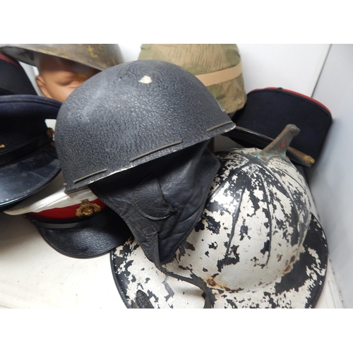 314 - A Quantity of Military Caps & Helmets