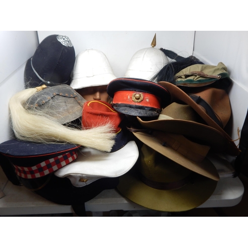 315 - A Quantity of Military Caps & Helmets