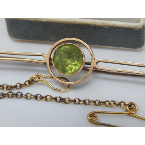 161 - 15ct Gold Brooch Set with a Central Peridot: Gross weight 4.5g together with a Small Childs 9ct Gold... 