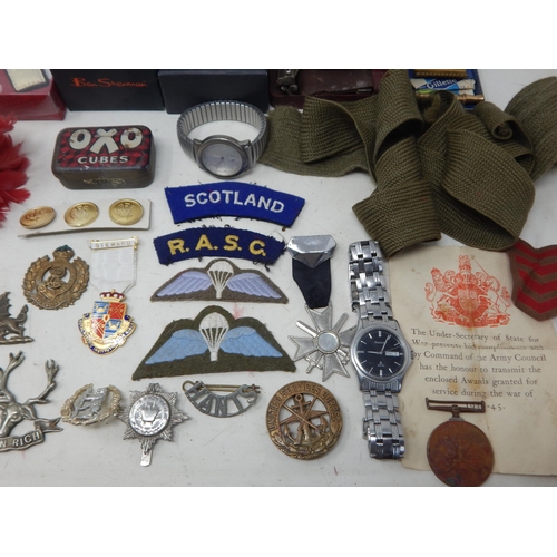 295 - A Quantity of Military Cloth & Metal Badges, Watches etc (lot)