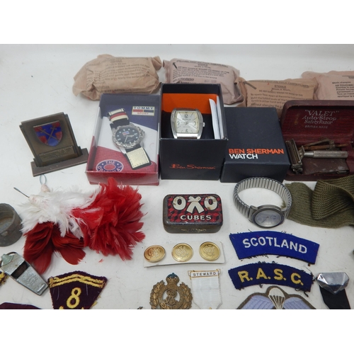 295 - A Quantity of Military Cloth & Metal Badges, Watches etc (lot)