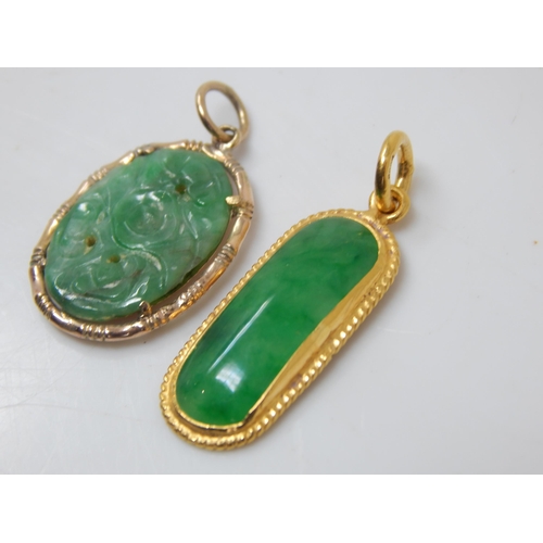 111G - High Carat Jade Pendant together with a further Gold Jade Pendant: Gross weight 5.70g