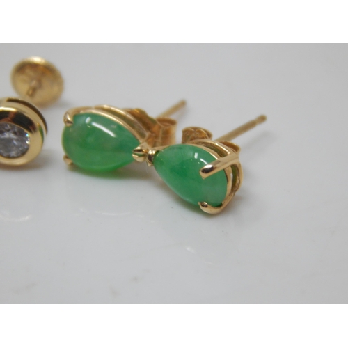 111P - A Pair of 18ct Gold Diamond Solitaire Earrings together with a Pair of 14ct Gold Jade Set Earrings.