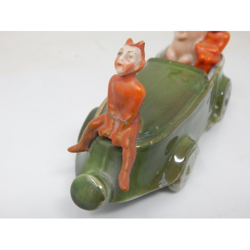 200B - Edwardian Novelty Ceramic Group of a Pig in a car with the devil. 15cm wide