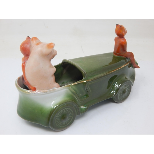 200B - Edwardian Novelty Ceramic Group of a Pig in a car with the devil. 15cm wide