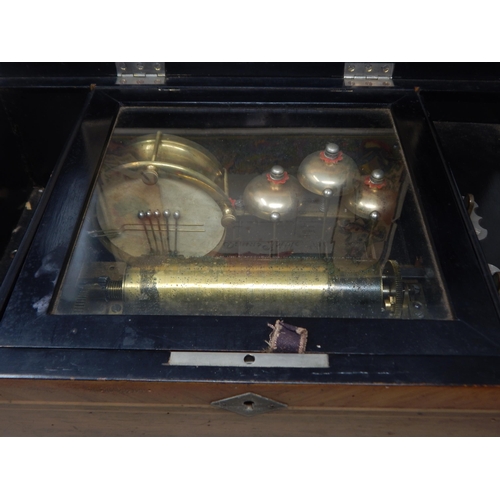 200C - 19th Century Swiss Music Box Playing Eight Airs. The Inlaid Case complete with key. Working when cat... 