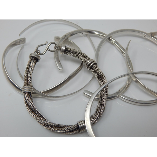 101W - A Quantity of Sterling Silver Bangles/Bracelets together with a Sterling Silver Identity Bracelet: W... 