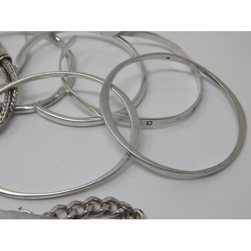 101W - A Quantity of Sterling Silver Bangles/Bracelets together with a Sterling Silver Identity Bracelet: W... 