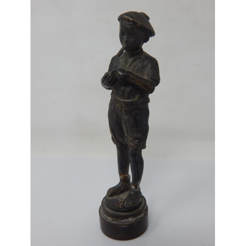 415 - A Bronze Desk Seal Formed as a Smoking Boy: Height 9.5cm: Repaired.