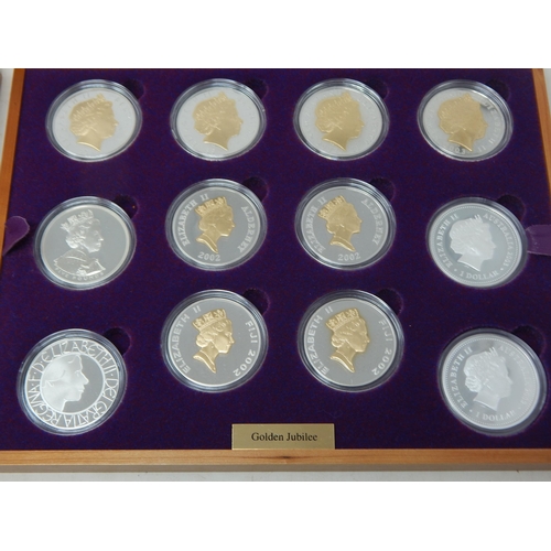 29 - Queen Elizabeth II Jubilee Silver Crown collection housed in original wooden collectors box with COA... 