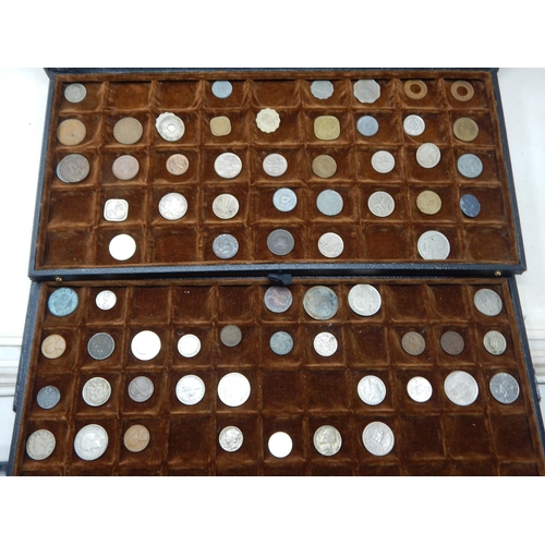 56 - A large collection of World coinage housed in collectors case with trays