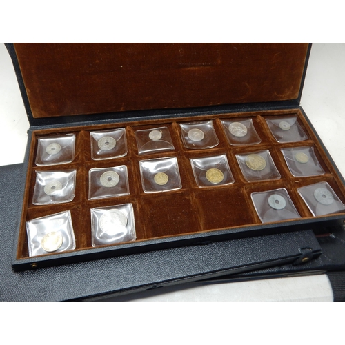 56 - A large collection of World coinage housed in collectors case with trays