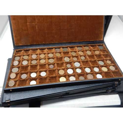 56 - A large collection of World coinage housed in collectors case with trays