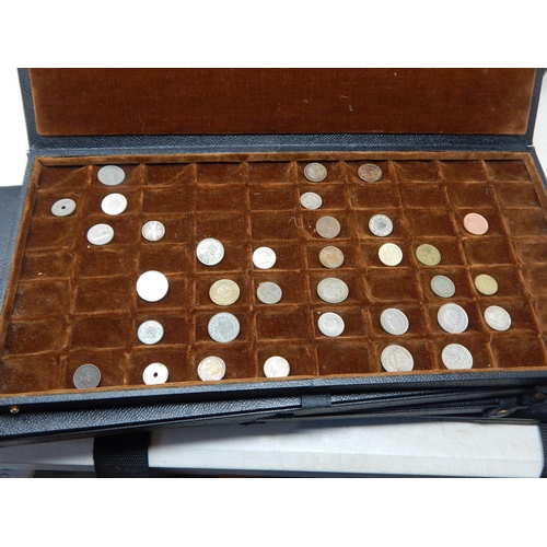 56 - A large collection of World coinage housed in collectors case with trays