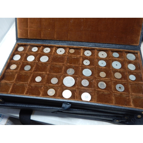 56 - A large collection of World coinage housed in collectors case with trays