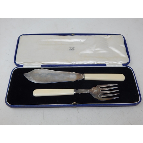 67 - Hallmarked Silver Fish serving knife and fork in fitted case with original price tag of £100 as purc... 